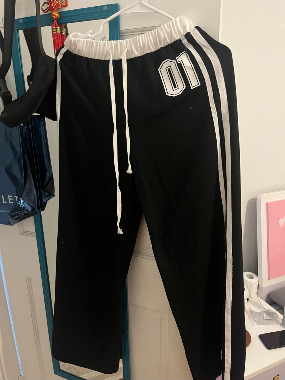 Black Track Pants with White Stripes & '01' Detail
